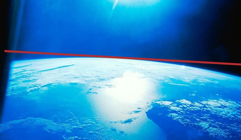 photo of the Earth from space with a horizontal line showing curve